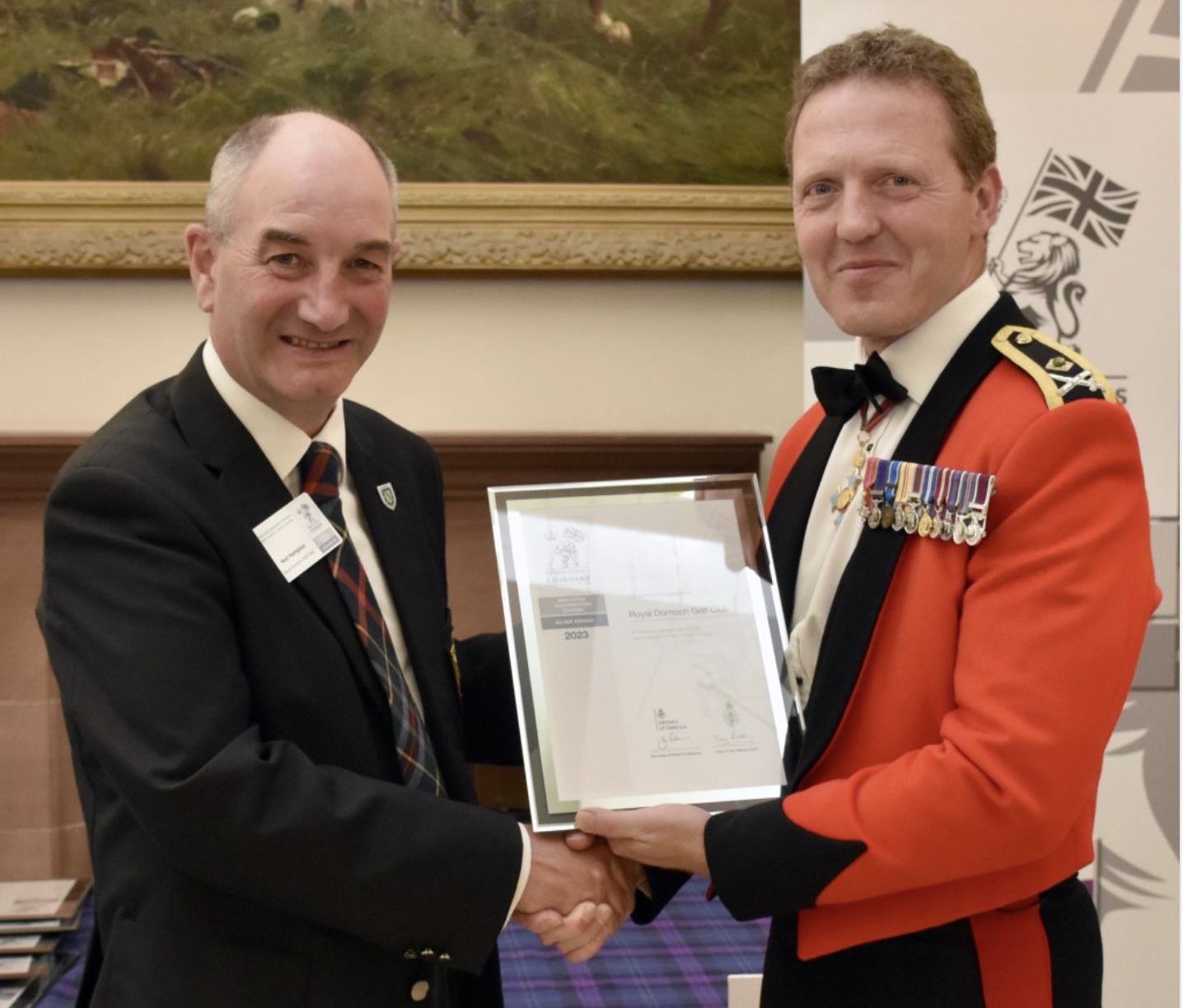 Neil Hampton, general manager of Royal Dornoch Golf Club, is presented with a Defence Employer Recognition Scheme Silver Award by Major General Bill Wright, General Officer Scotland, at a ceremony in Perth