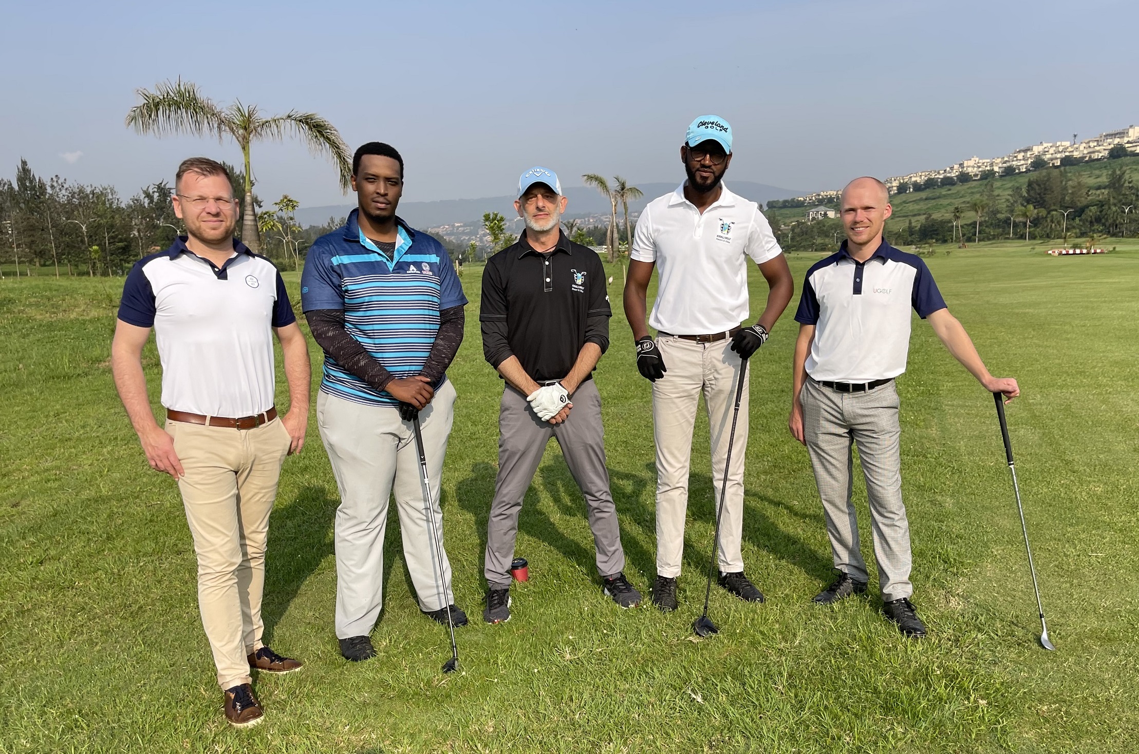 Nathanaël Pietrzak-Swirc (left), UGOLF International CEO, with officials from Kigali Golf Resort