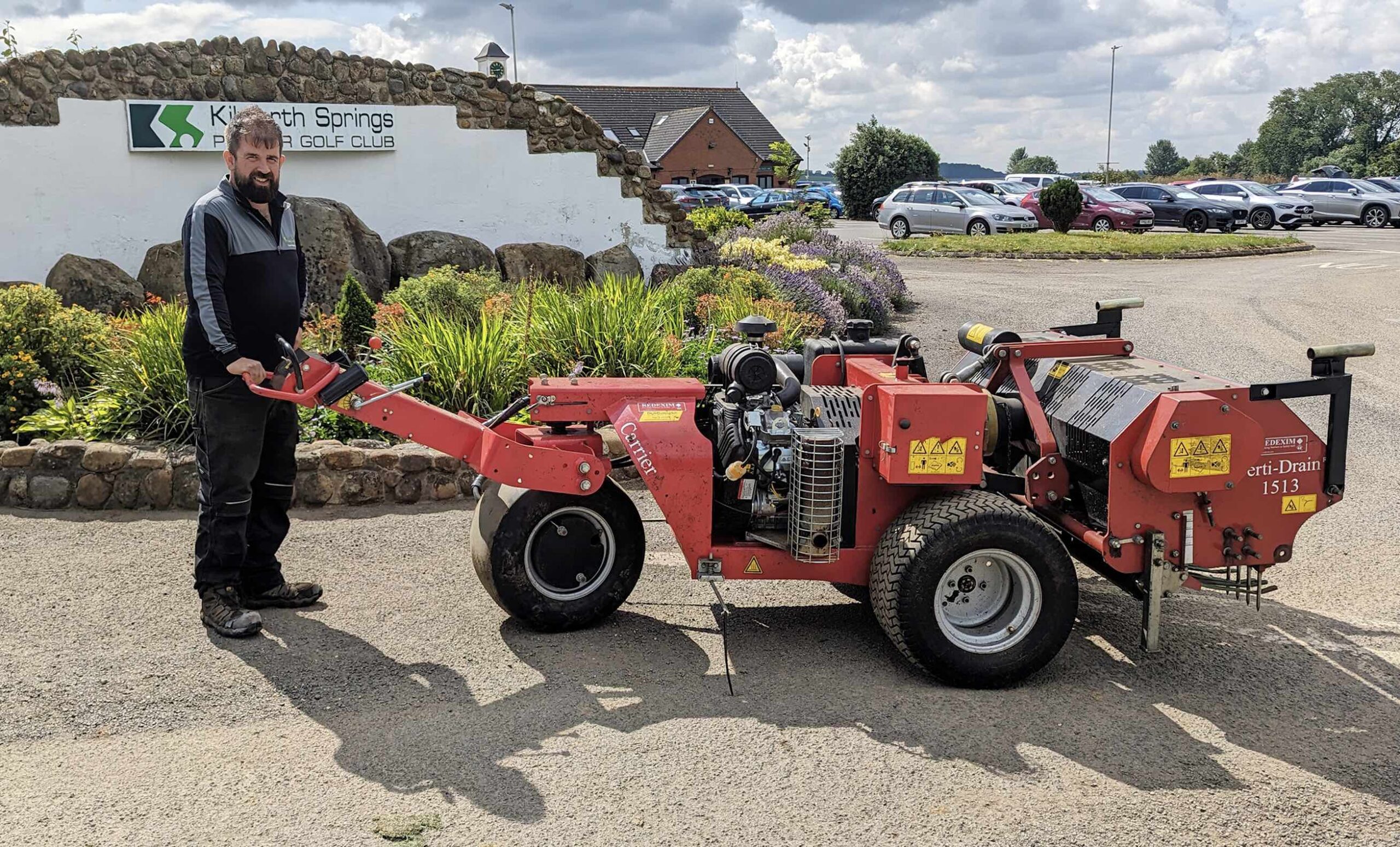 Head Greenkeeper Joel Chappell  with the Redexim Verti Drainer