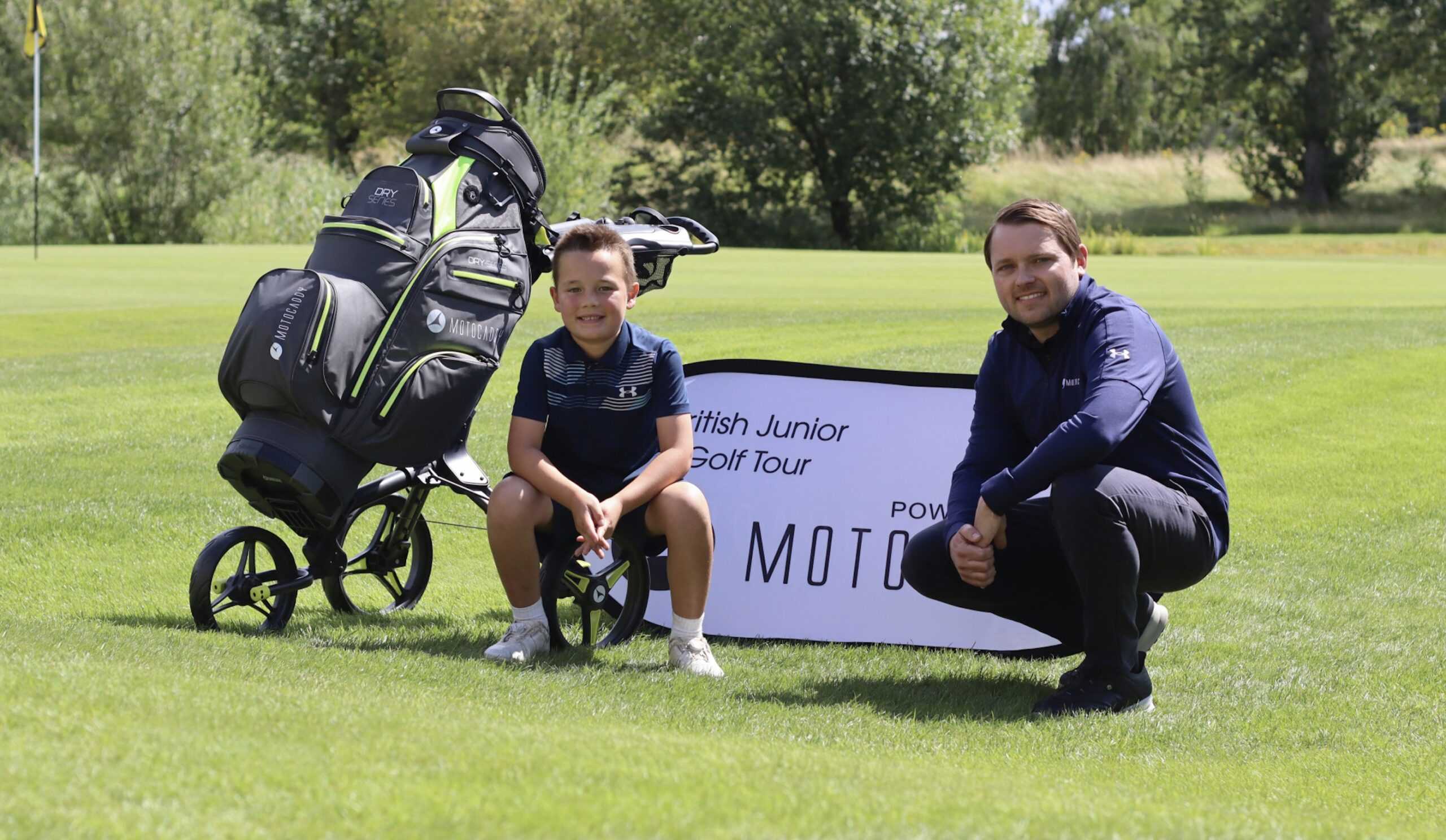 Louie receives his Motocaddy pushcart and bag from Motocaddy Marketing Manager Oliver Churcher
