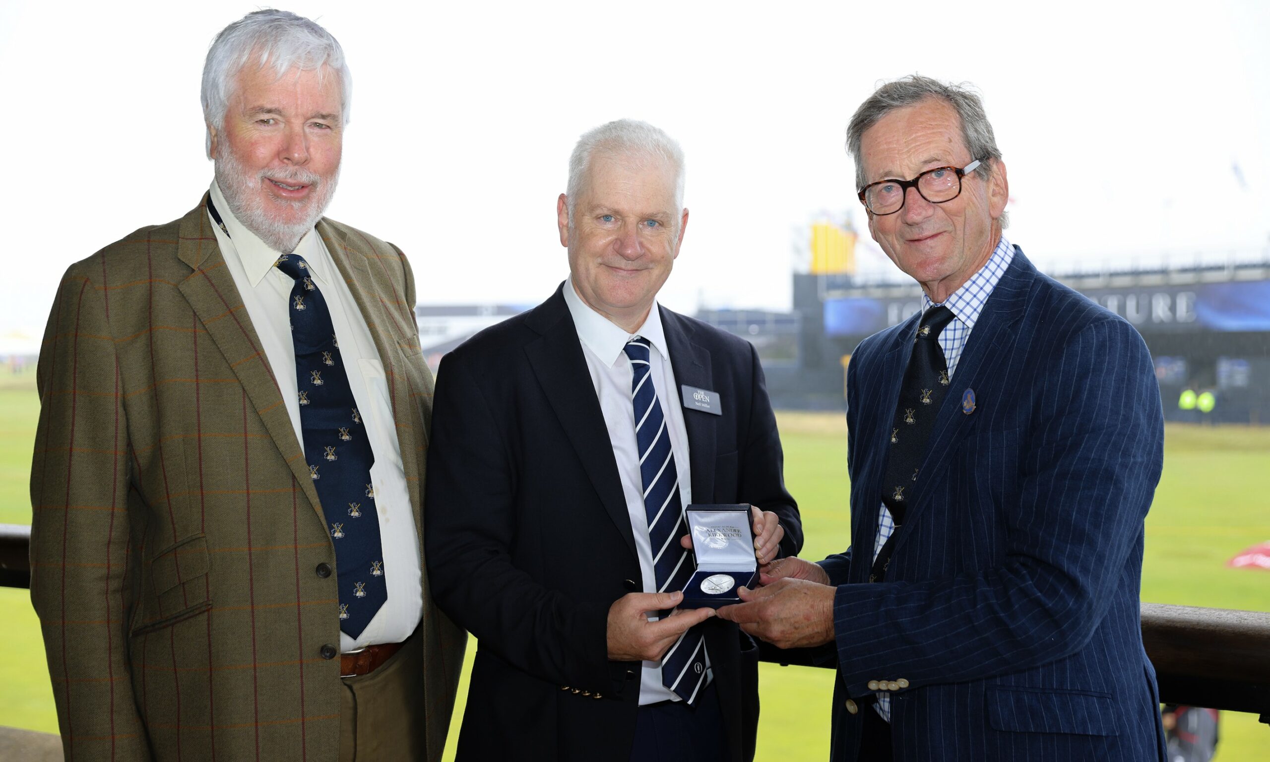 Neil Millar (centre) receiving the Murdoch Medal at Royal Liverpool Golf Club from Richard Williams (left), chairman of the award committee, and Bob Chadwick, British Golf Collectors Society Captain