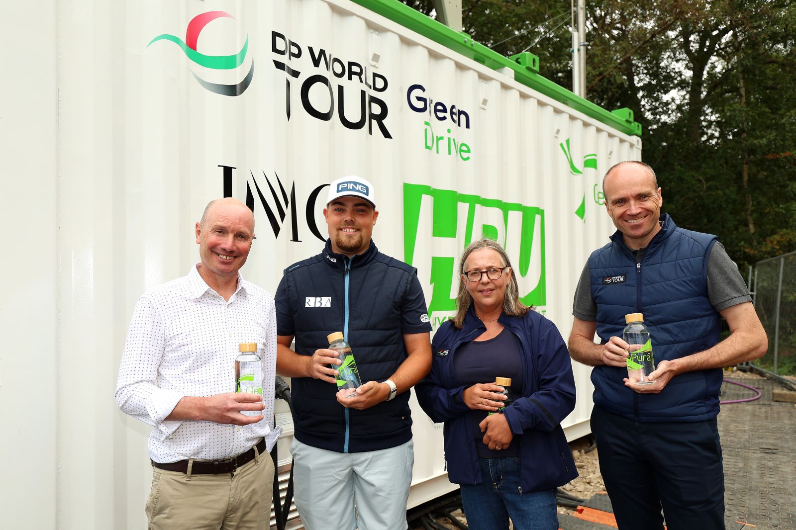 (from left) Andrew Cunningham, CEO of GeoPura, DP World Tour player Dan Bradbury, Sally Wood, Head of Golf Content at IMG, and Andrew Lynch, Head of Sustainability at DP World Tour) holding the pure water emitted by the hydrogen power units (Credit Getty Images)