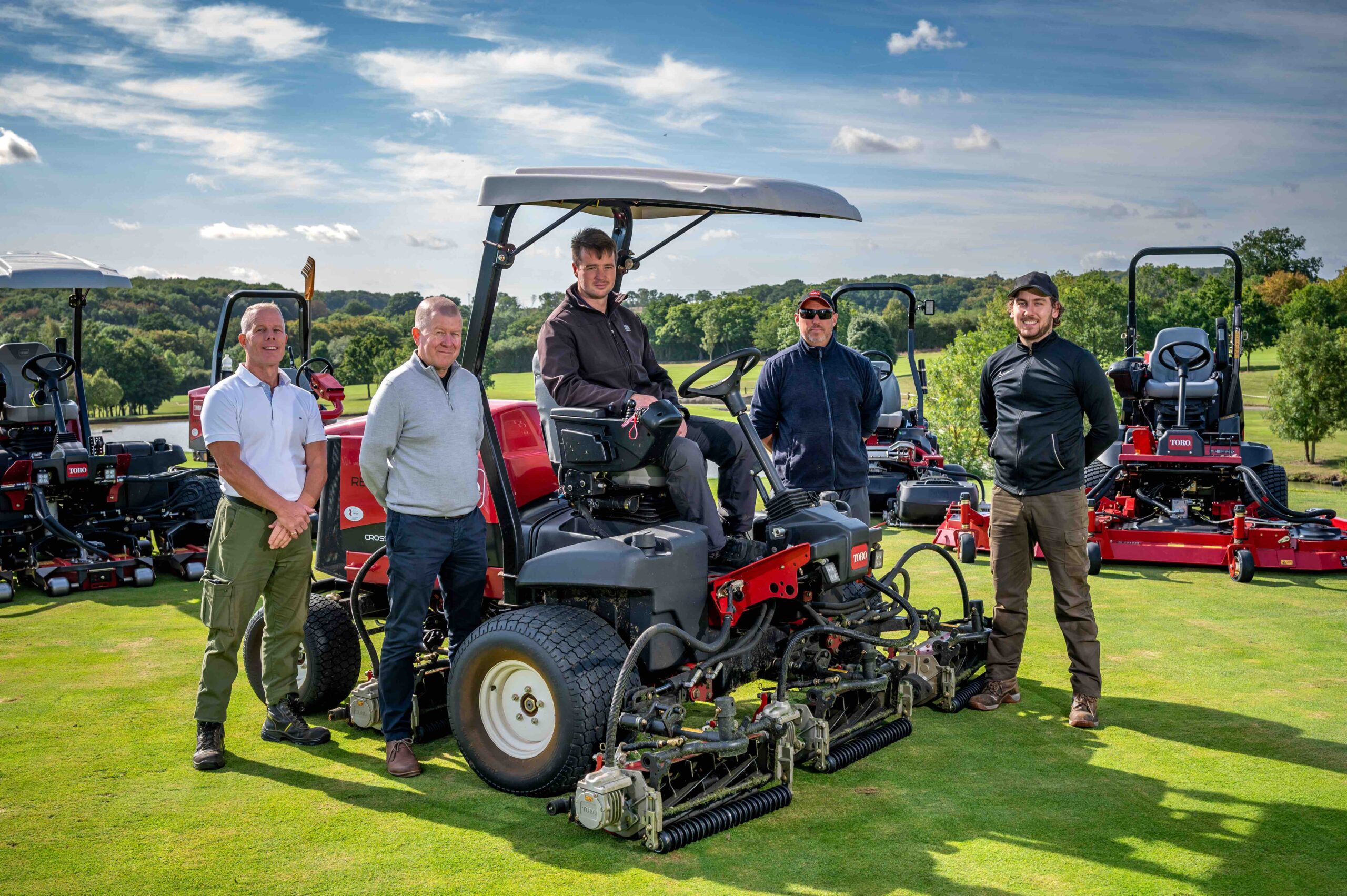 Course manager Tom Cook (centre) on new Toro Reelmaster 5010-H pictured with Reesink Turfcare’s Richard Freeman (centre-left) and the Toot Hill Golf Club greenkeeping team