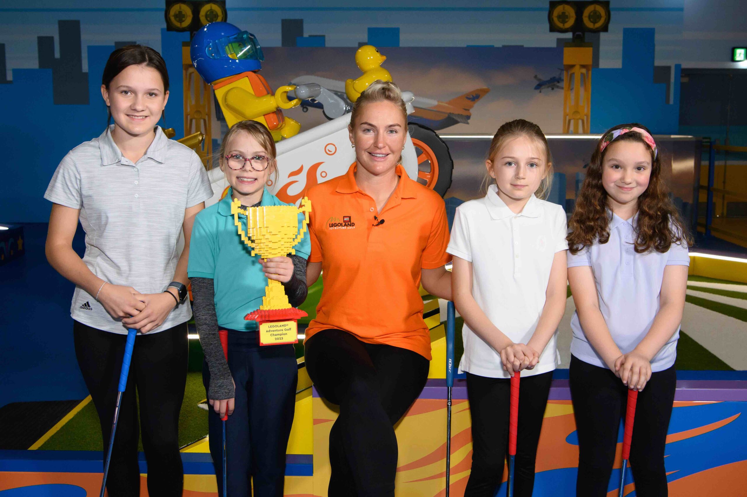 Charley Hull tees off with four young golf fans at the world's first LEGO themed golf attraction, LEGOLAND Adventure Golf at the LEGOLAND Windsor Resort