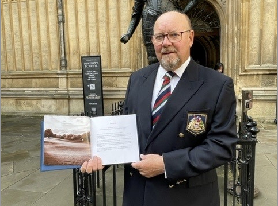 Oxford GC's former secretary Colin Whittle with a copy of the club's history that has been donated to the Bodleian Library at Oxford University