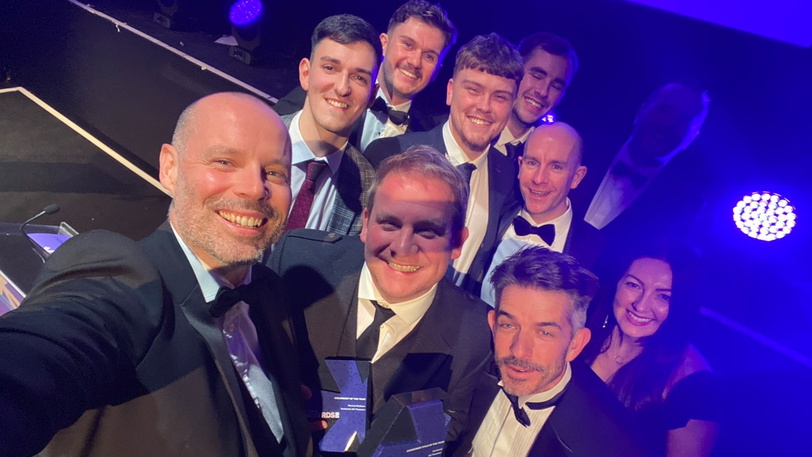 ‘bunkered editor Bryce Ritchie and deputy editor Michael McEwan (both front row) lead the celebrations for the title’s PPA win’