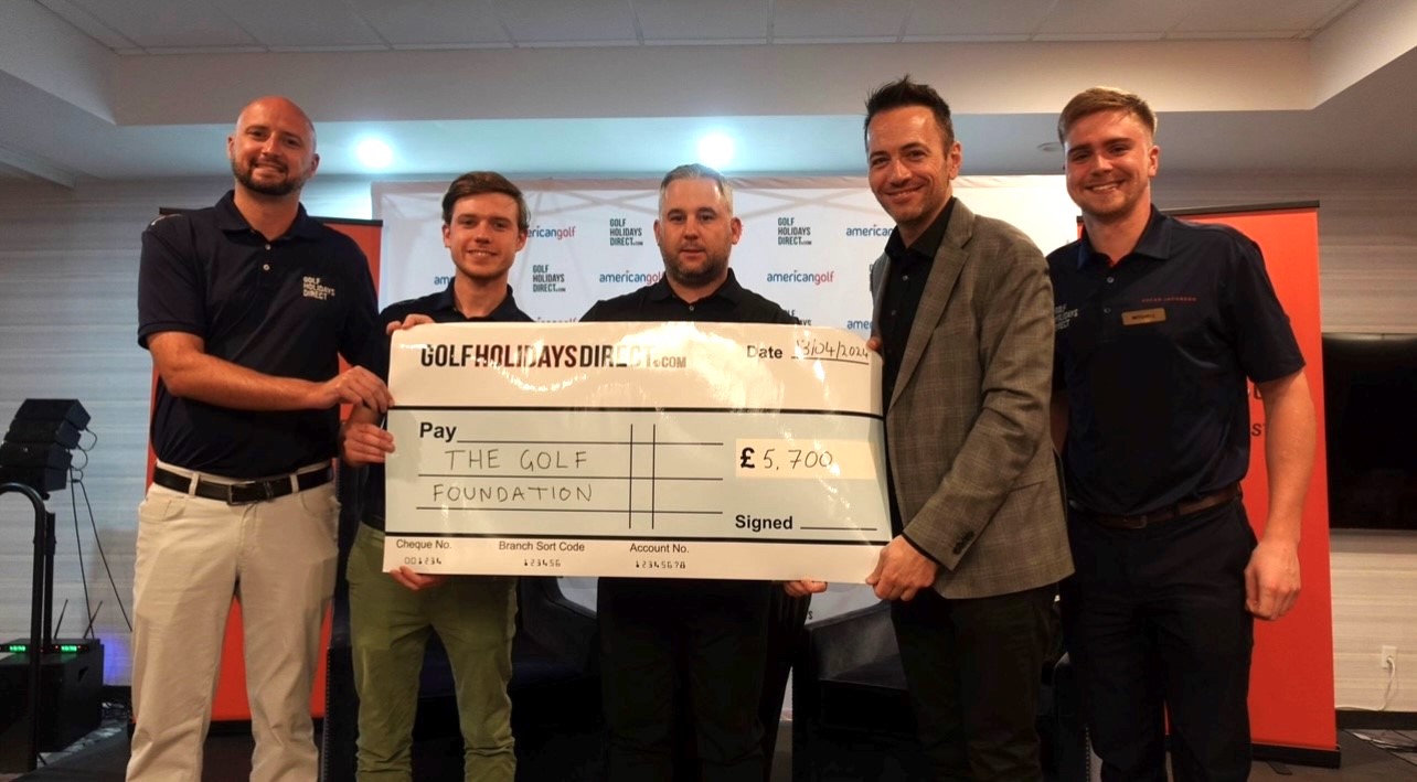 Golf Holidays Direct team present Golf Foundation President Nick Dougherty with funds raised