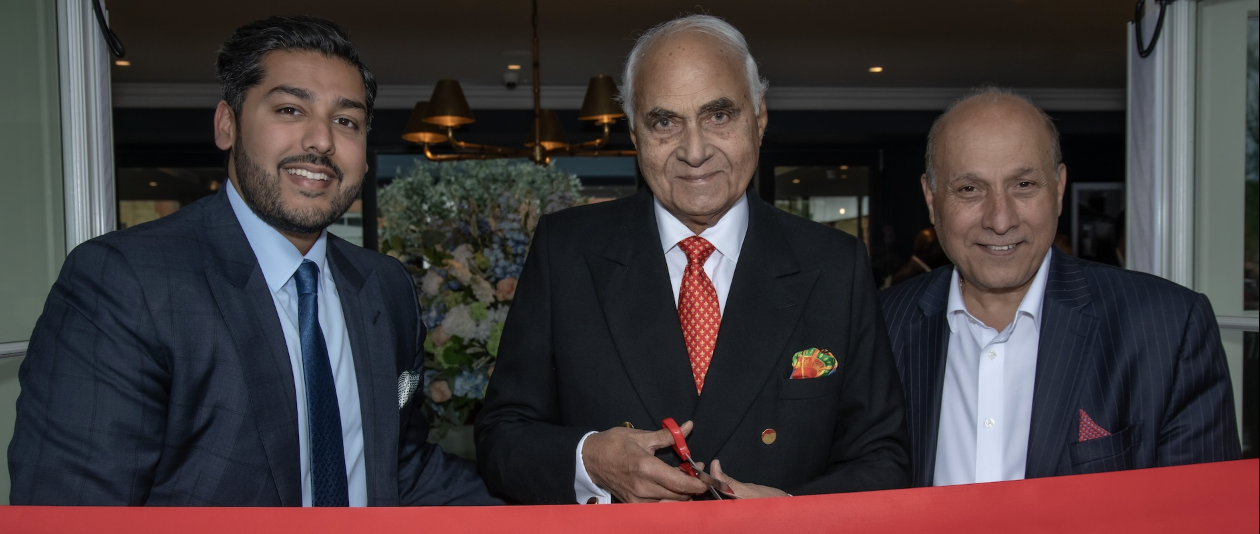 VIP guest KP Singh cuts the ribbon to officially open the new clubhouse at The Buckinghamshire, alongside Sanjay Arora (left) and Surinder Arora (right), whose Arora Group owns the club