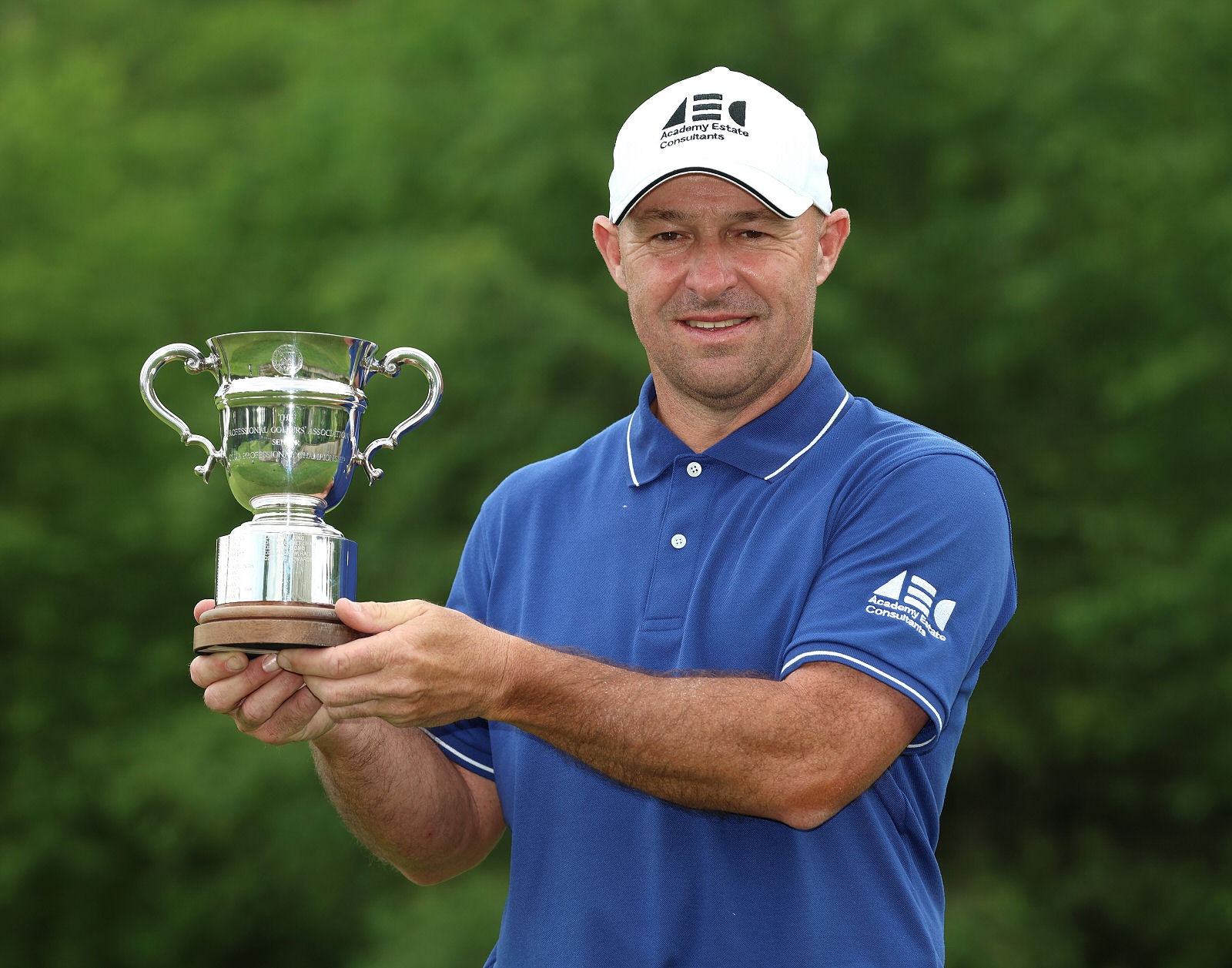Robert Coles poses with the trophy. (Photo by Luke Walker/Getty Images)