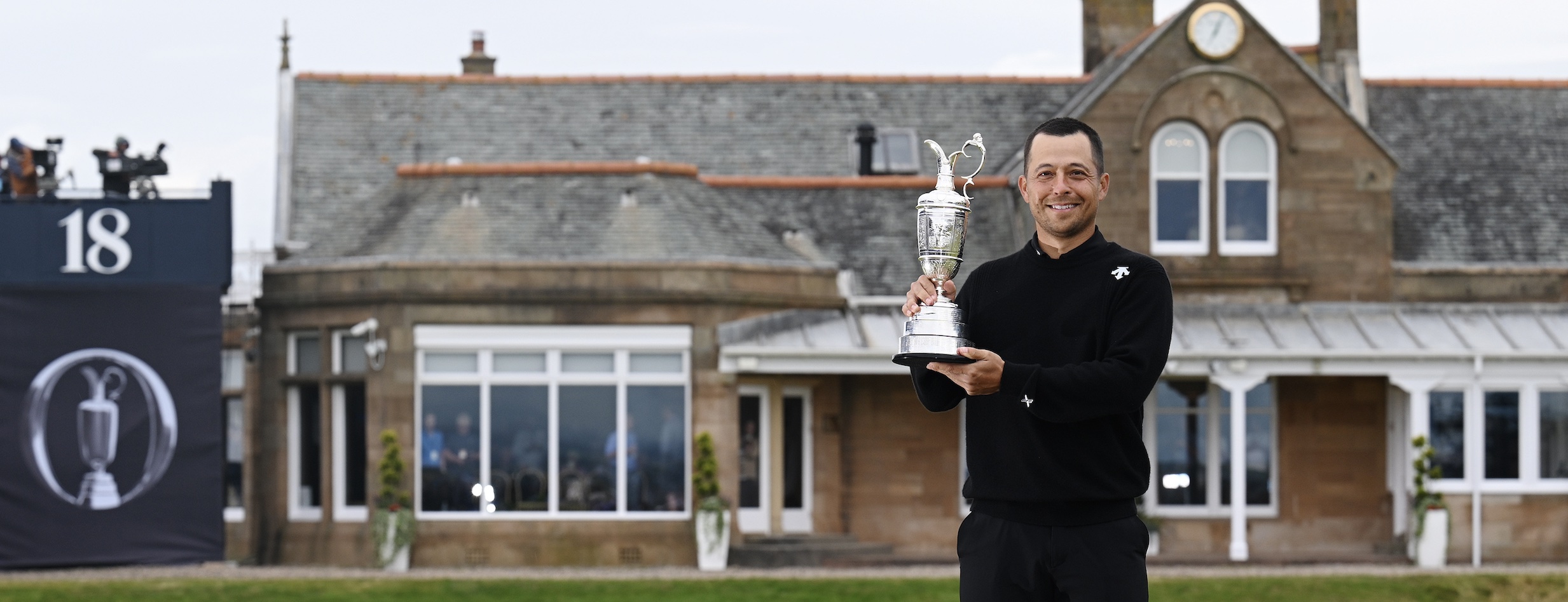 Xander Schauffele of the United States lifts the Claret Jug on the 18th green in celebration of victory on day four of The 152nd Open championship at Royal Troon on July 21, 2024 in Troon, Scotland. (Photo by Stuart Franklin/R&amp;A/R&amp;A via Getty Images)