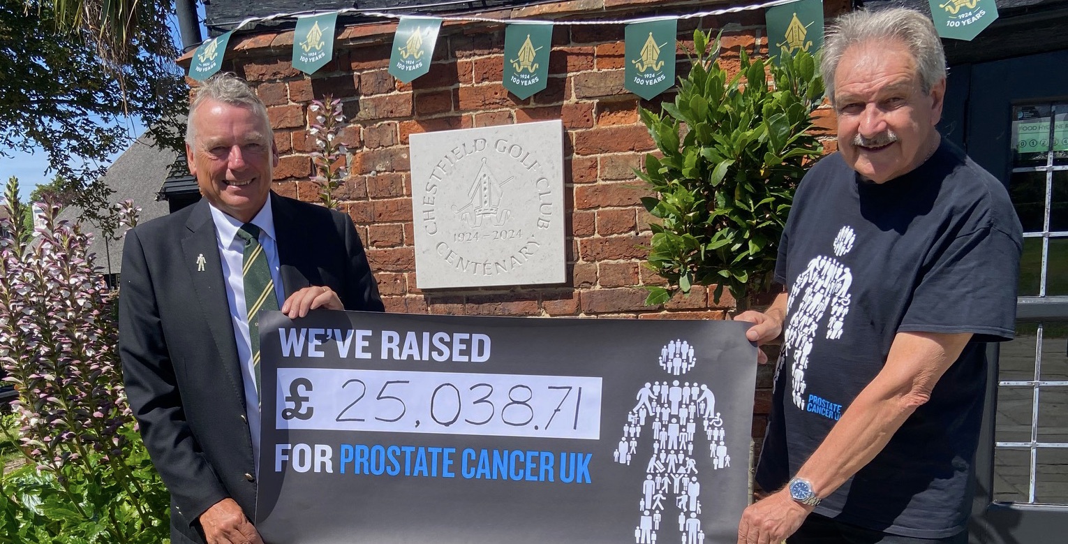 Chestfield club captain David Wells hands over the cheque to Prostate Cancer UK ambassador Terry Potter