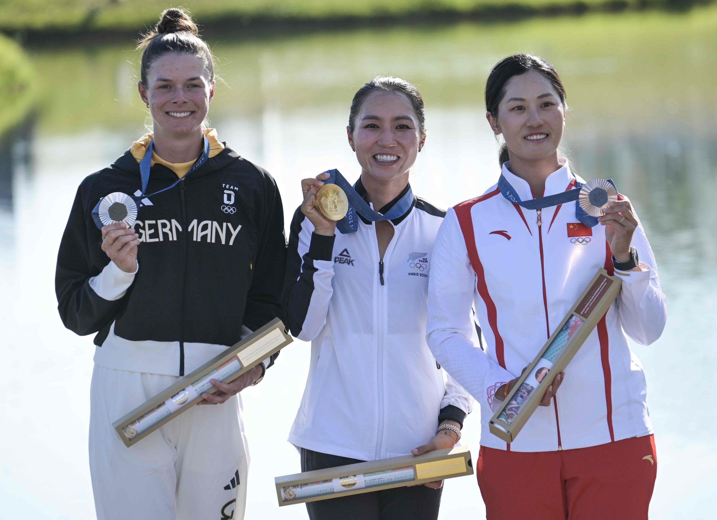 Gold medal winner Lydia Ko flanked by Germany’s Esther Henseleit with silver and China’s Xiyu Lin with bronze - all of whom wear ECCO golf shoes