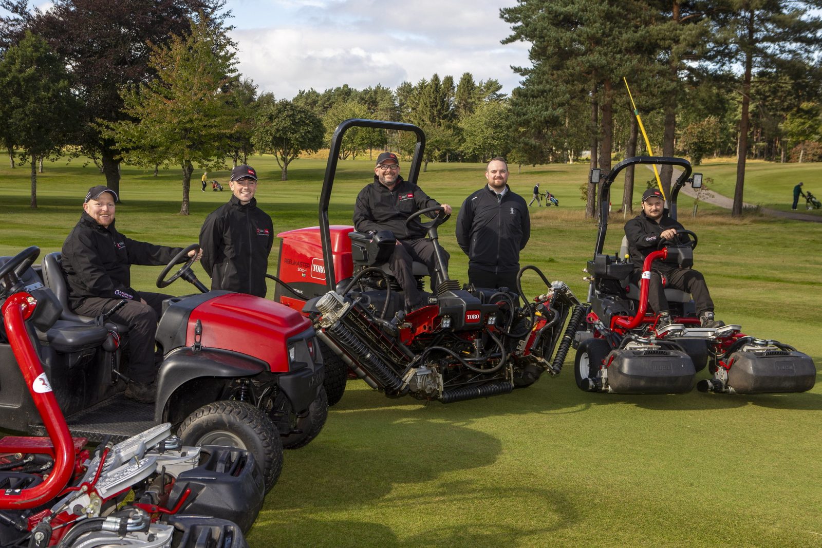 Ross Macleod, Head Greenkeeper, seated centre, with Sean Blacklaw, General Manager, on the right of Ross, and members of the greenkeeping team and some of the new Toro fleet.