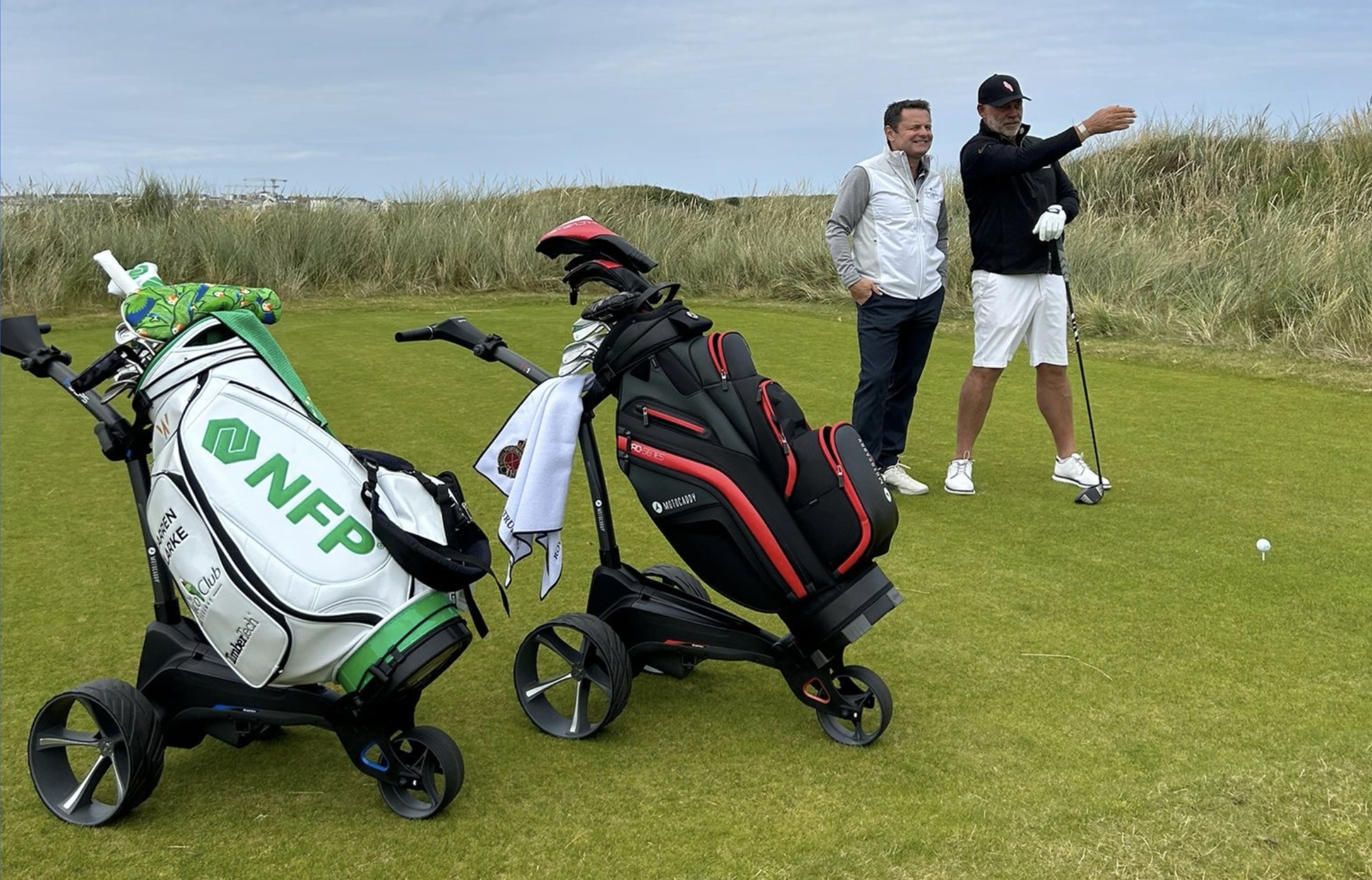 Darren Clarke shows Chris Hollins the line off the tee at one of the holes at Royal Portrush during the filming of Golf's Great Holes