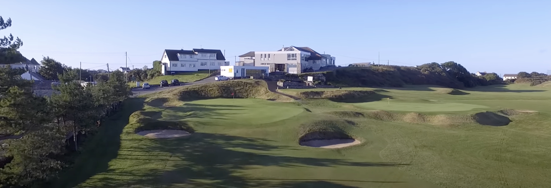 Holyhead GC is planning to move the green at its 18th hole after it was closed due to health and safety issues caused by errant golf balls