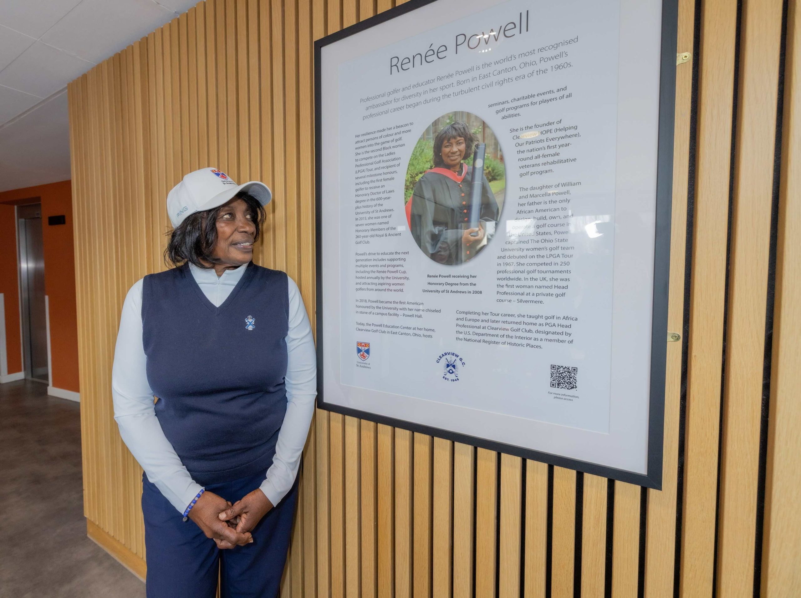 Dr Renee Powell at the newly-unveiled plaque in Powell Hall student residence in St Andrews 