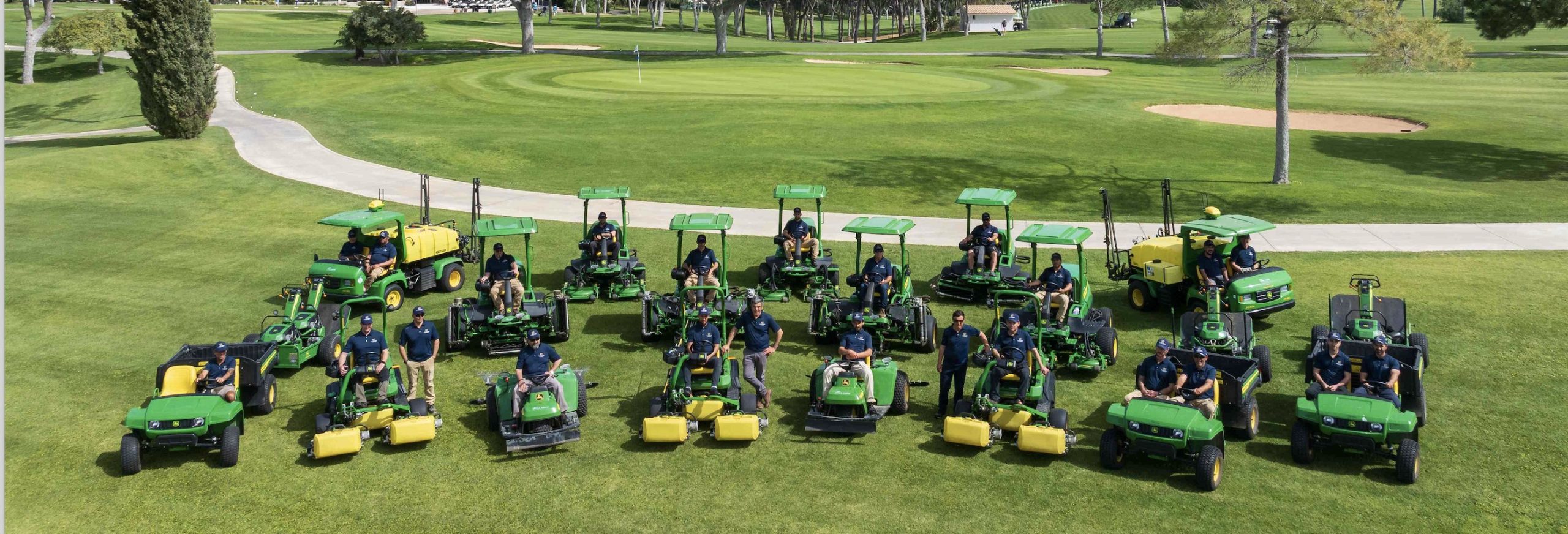 Gil Gomes, CEO of Torre Marco, John Deere Ag & Golf dealer; Nuno Sepulveda, Co-CEO of DETAILS, and Paul Baulieu, Golf & Turf Manager of John Deere, with the new fleet of John Deere course machinery at The Old Course Vilamoura