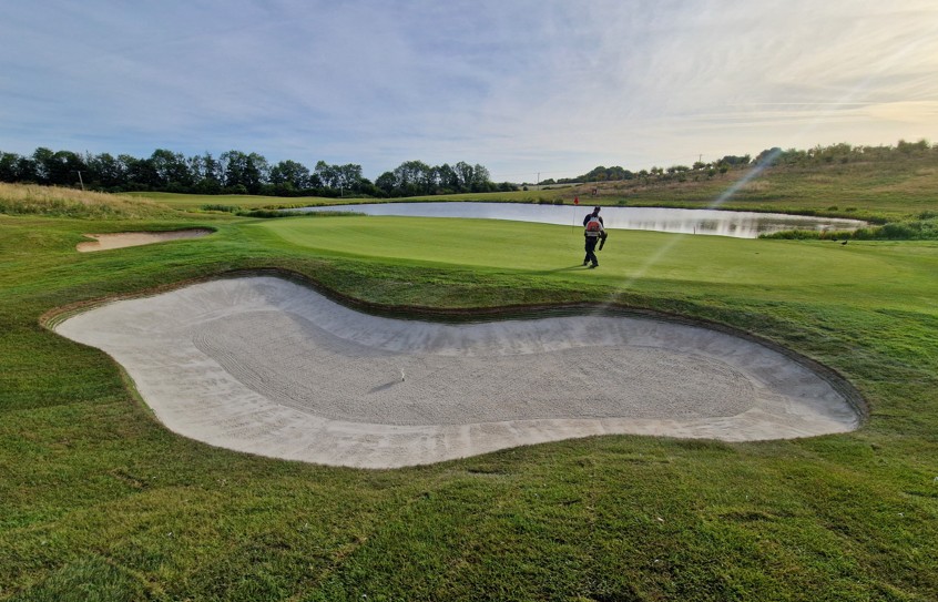 Our three photos of the renovation process illustrate construction, liner fitting and the completed bunker (above)