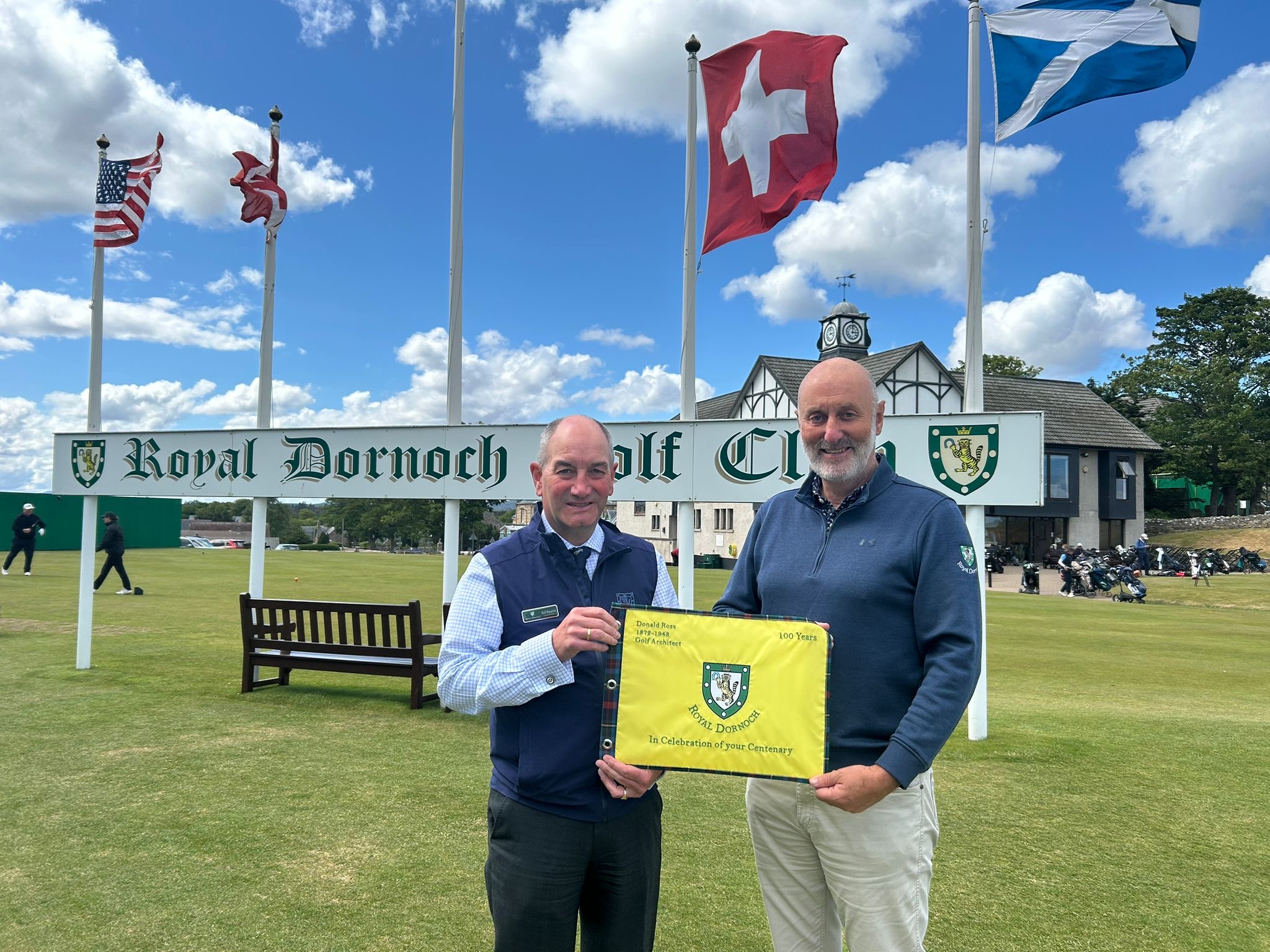 Royal Dornoch general manager Neil Hampton (left) and captain Gary Bethune with the special pin flags which will be sent to Donald Ross designed courses in North America which are celebrating their centenaries. 