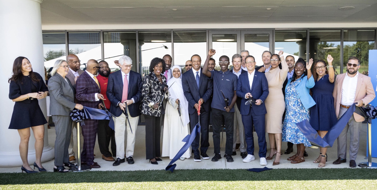 Tiger Woods cuts the ribbon at the official opening of the new TGR Learning Lab at at Cobbs Creek Golf & Education Campus
