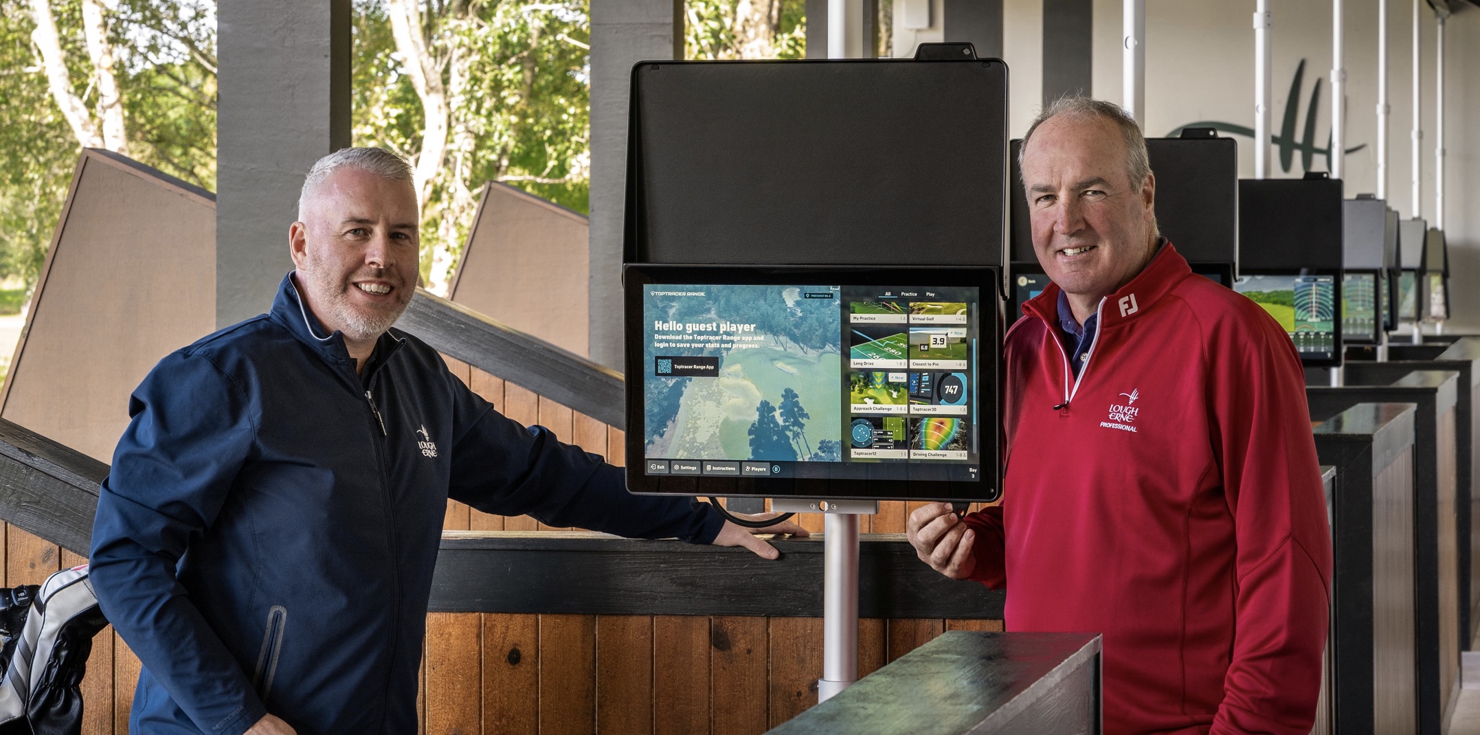 Resident PGA Professional Damian Mooney and Barry McCauley, Director of Golf at Lough Erne Resort, with the Toptracer system installed across eight bays on the resort’s driving range