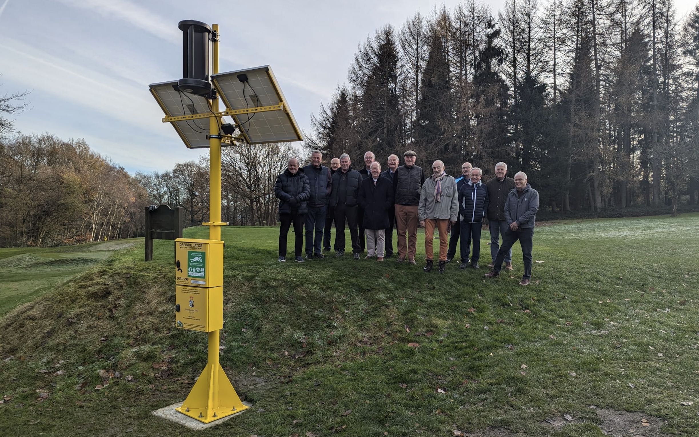 Representatives from Woodsome Hall Golf Club with Turtle’s wind and solar powered defib cabinet