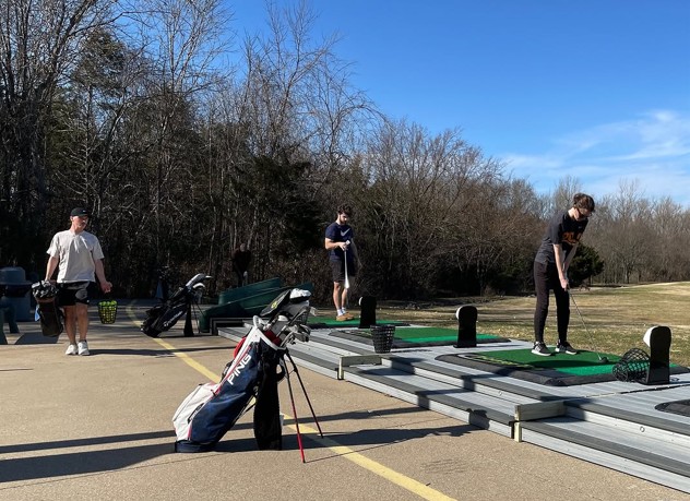 Golfers on Power Tees at Go USA Fun Park