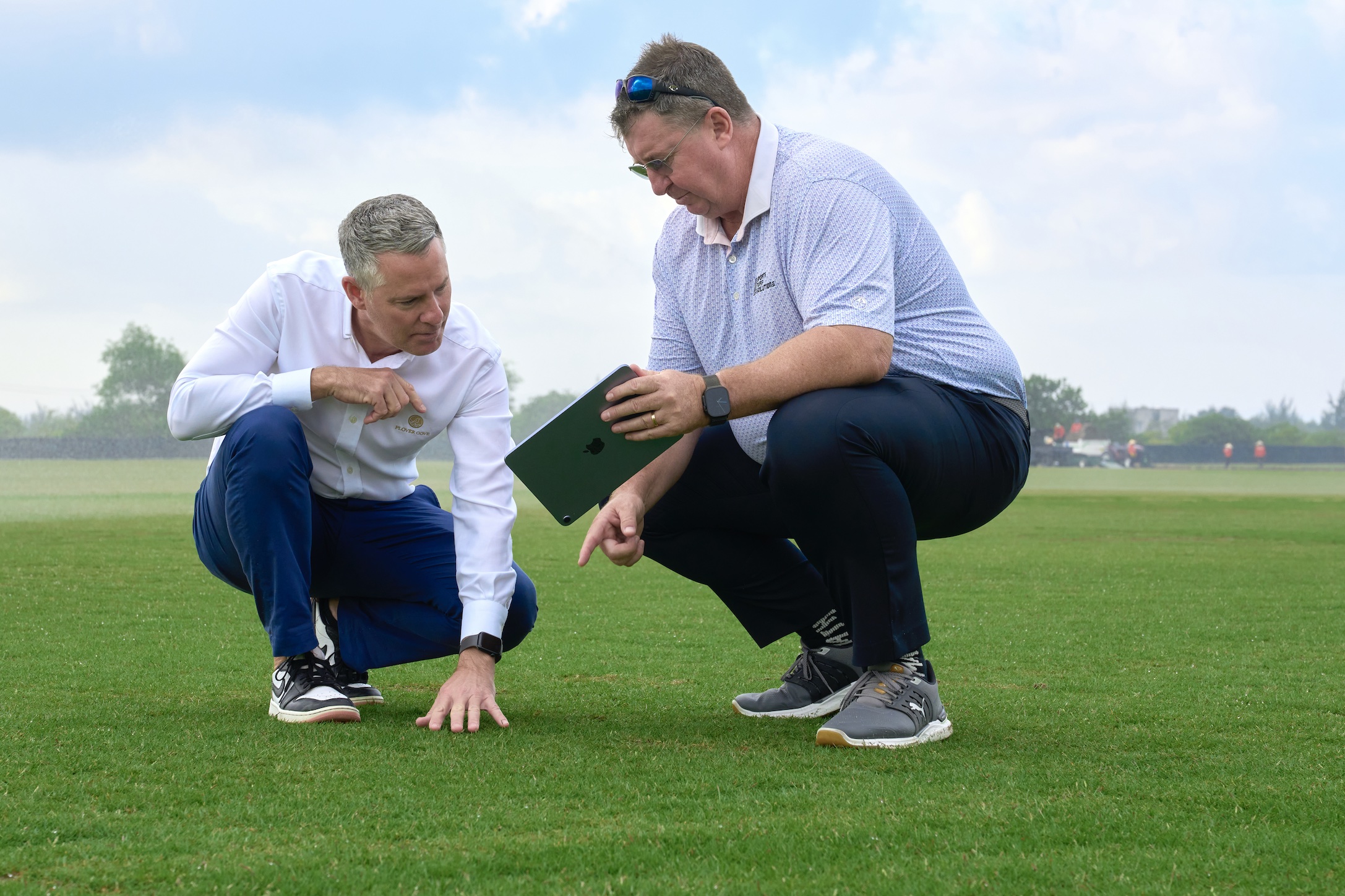 Dean Nelson, General Manager of Plover Cove Golf Club, and Brad Burgess of Sustainable Turf Farm during a site visit to assess turf quality