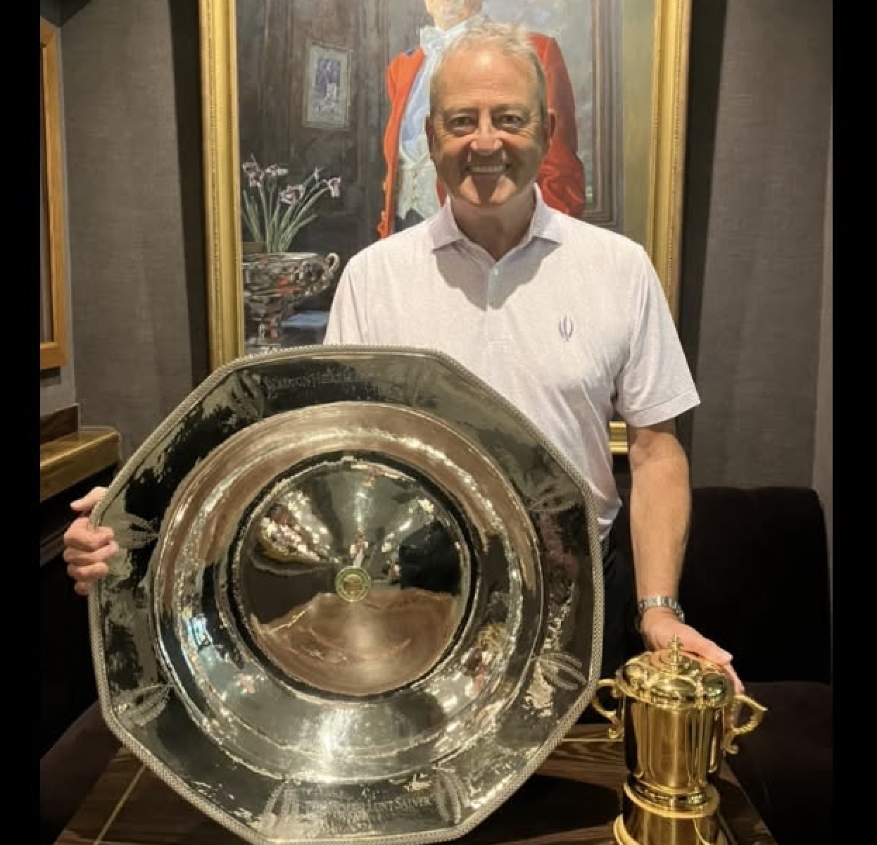 Nick Battinson with the Michael Lunt Salver and the Jill Thorhill Trophy, the prizes for men and women respectively for The Walton Heath Trophy