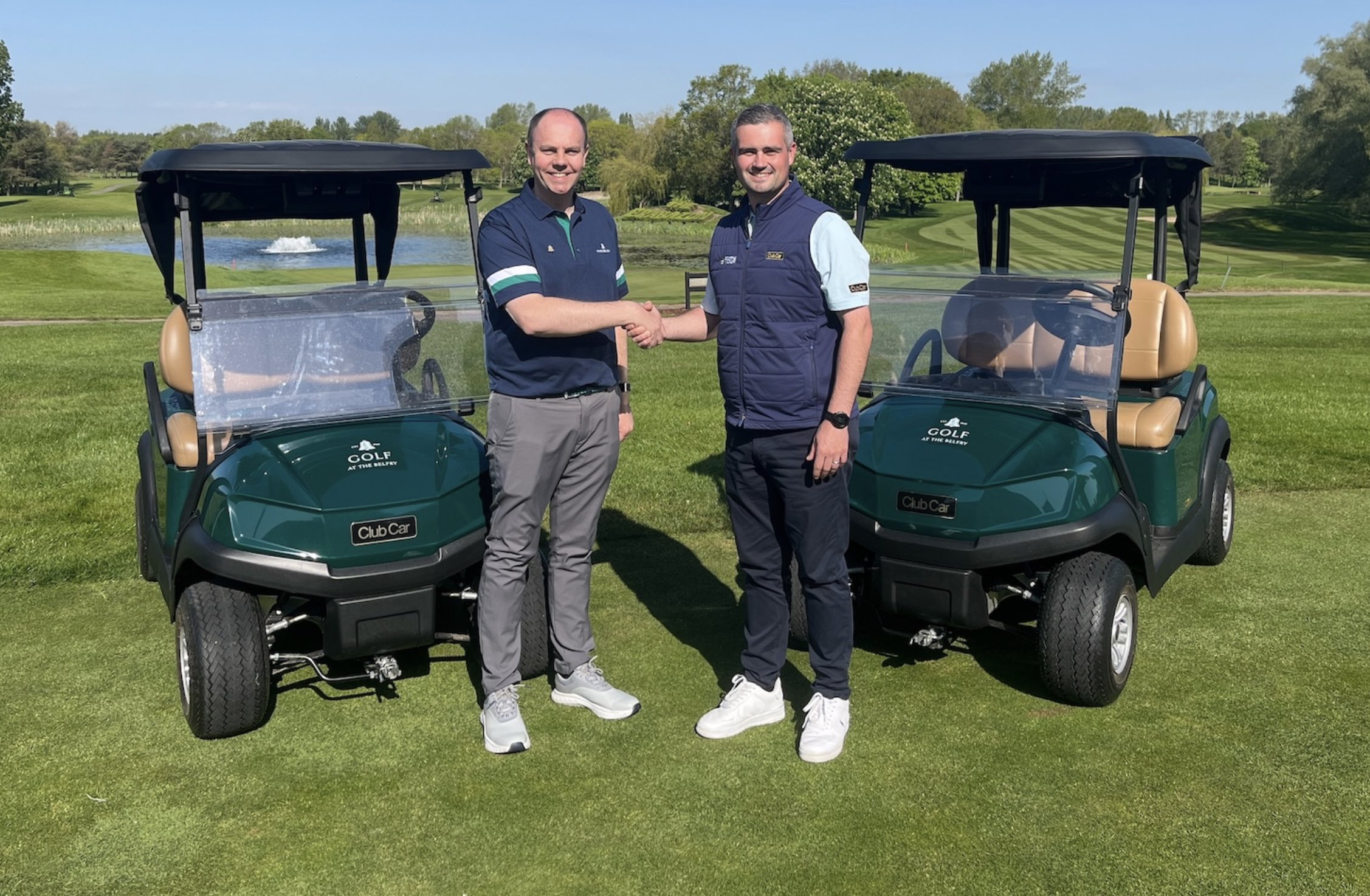 Tom Hughes, The Belfry's Head of Golf, shakes hands with Club Car Regional Sales Manager Andy Bourke, following the delivery of 40 new Club Car Tempo vehicles
