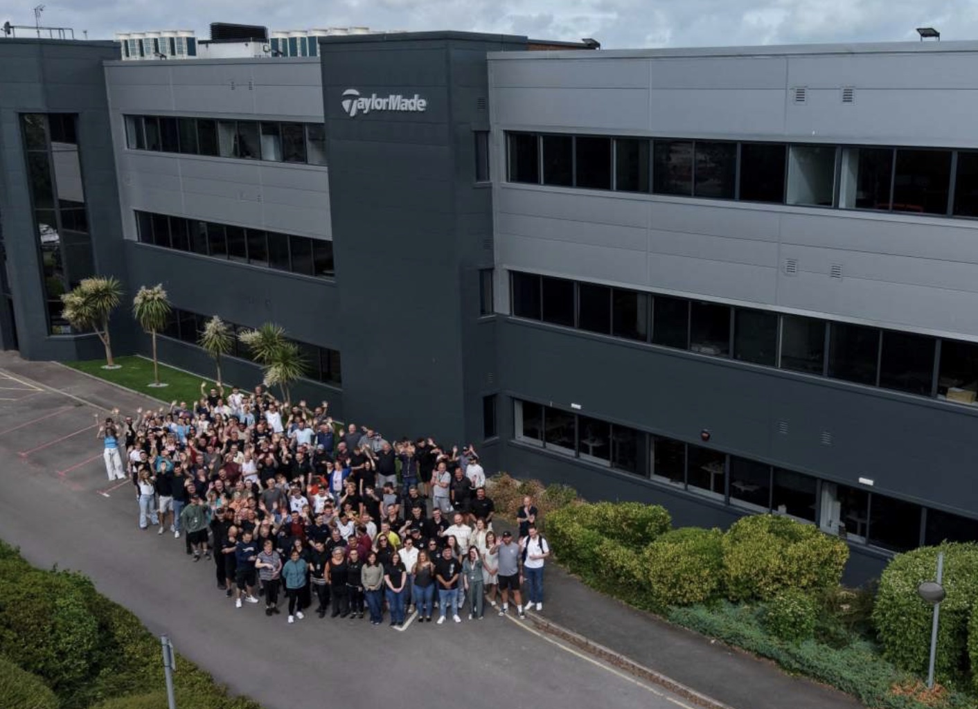 TaylorMade Golf staff gather outside its UK and European headquarters in Basingstoke, Hampshire