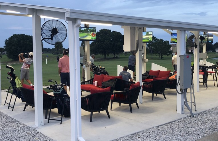 The covered bay section of Black Bear Golf Club's driving range