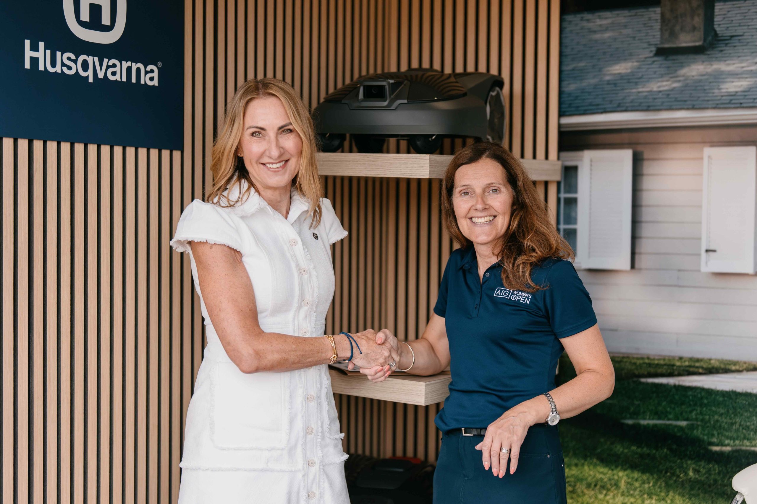 Yvette Henshall-Bell, President, Husqvarna Forest & Garden Division, shaking hands with Jackie Davidson, Director - Golf Education at The R&A following the signing of The R&A Women in Golf Charter