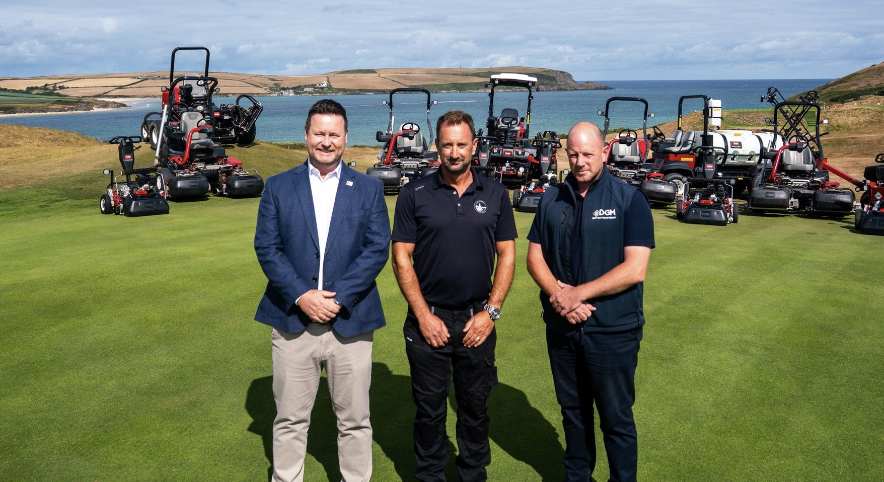 St Enodoc Head Greenkeeper William Smith (centre) with Reesink’s Darren Anderson (left) and Rob Read at DGM, pictured with some of the Toro machinery involved in the fleet deal