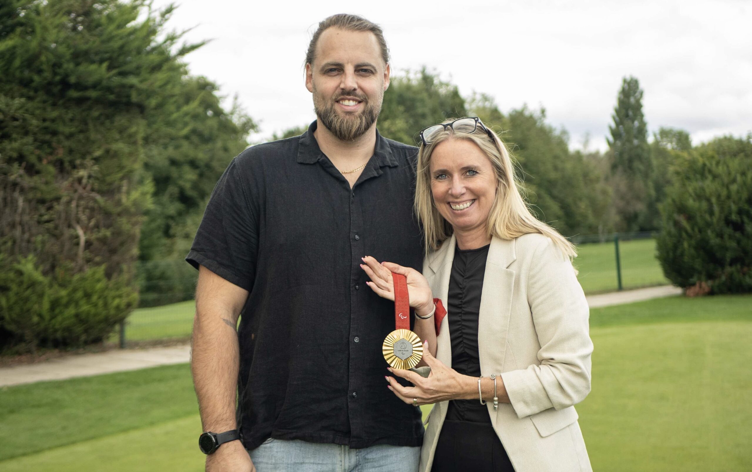 2024 Paralympic Games taekwondo gold medallist Matt Bush pictured with Wales Golf CEO Hannah McAllister